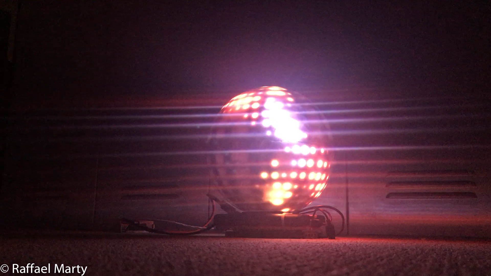 Finished orb lit in purple and blue