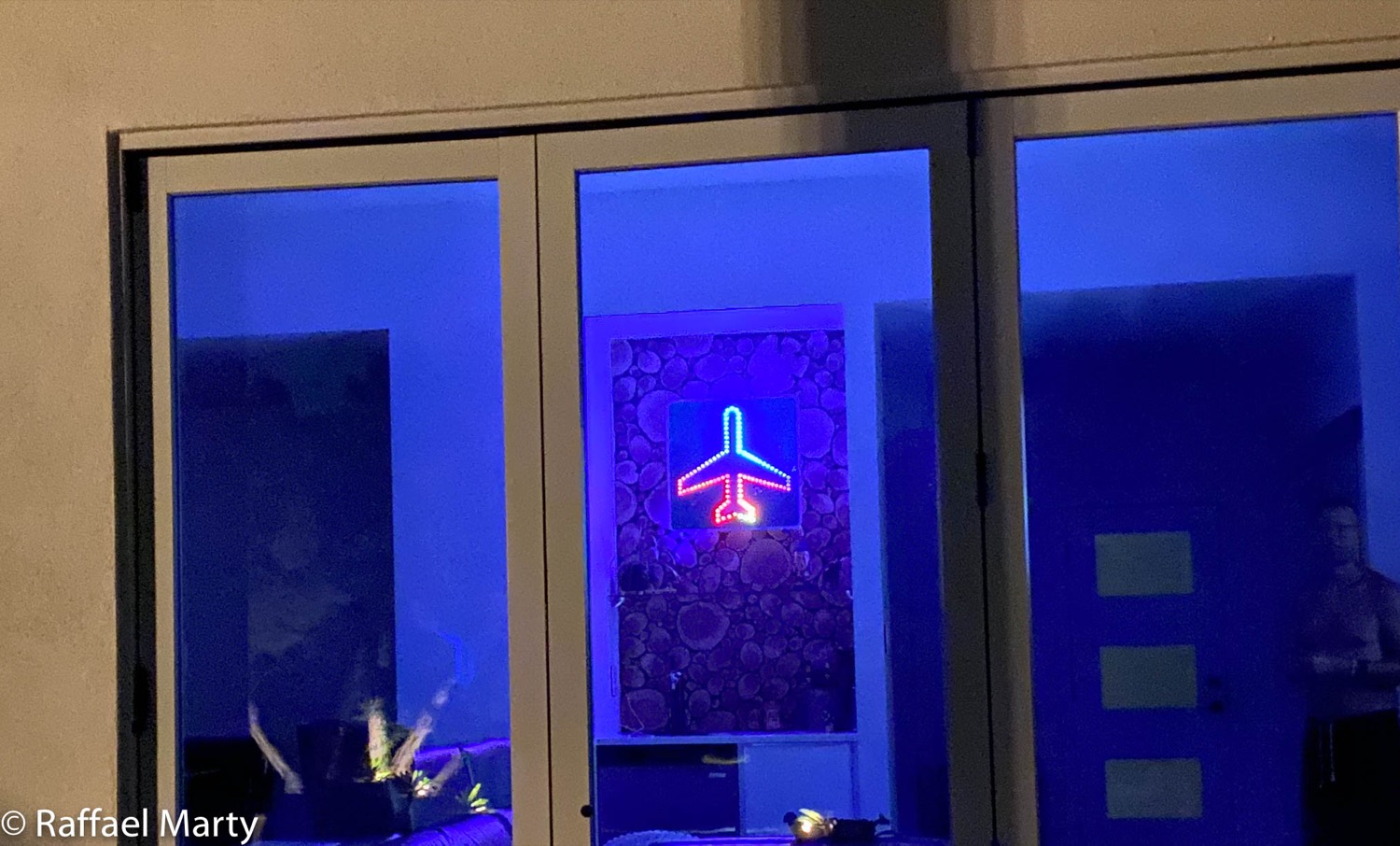 Finished airplane sign mounted and illuminated