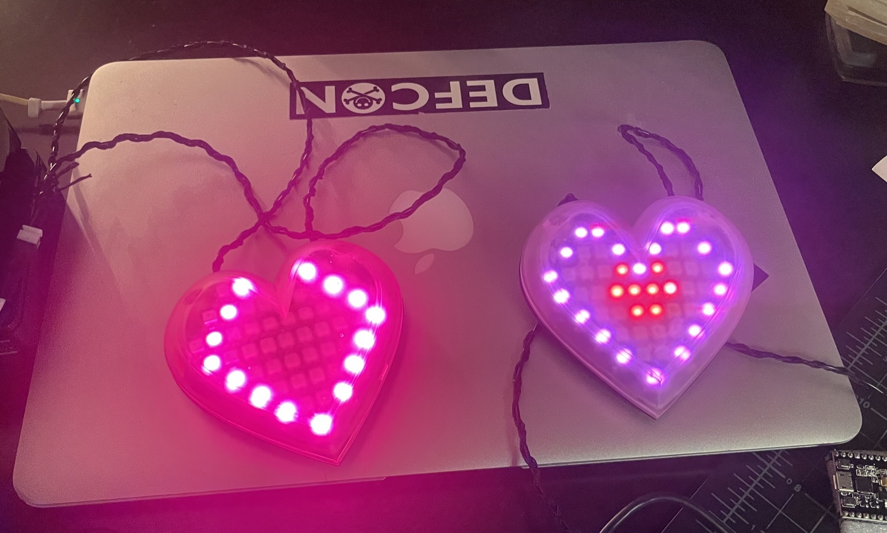 Finished LED heart necklaces illuminated in multiple colors
